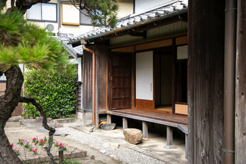 Fototapeta na wymiar Views of an old Japanese style house with its garden and a small lake in Yanagawa, Fukuoka, Japan.