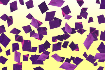 Shiny purple confetti falling on gradient yellow background