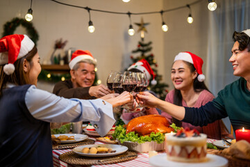 Asian lovely family celebrating christmas party together in house. 