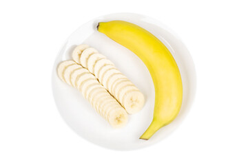 Yellow bananas and banana slices neatly placed on a round plate. transparent background