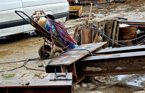 Pure oxygen, instead of air, is used to increase the flame temperature to allow localized melting of the workpiece material in a room environment