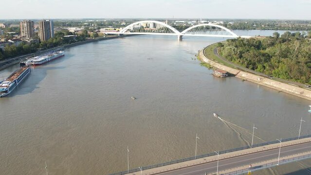 Aerial Drone View of Arch Bridge Over River with Green Island Landscape