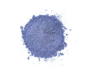 Heap of dry blue matcha powder from clitoria flowers on a white background, top view.