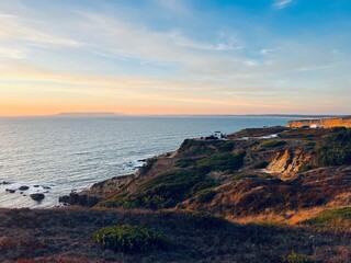 Ocean and purple sky at the ocean bay, orange ocean horizon