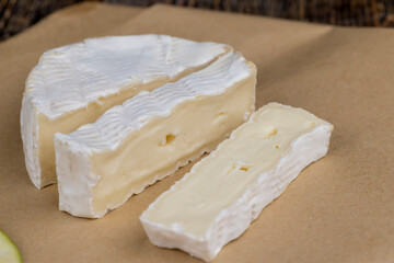 soft processed cheese with white mold on the table