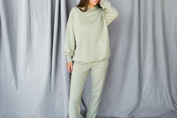 Horizontal studio photo for sports clothing sale. Model Showcasing a Stylish and Comfortable Outfit...