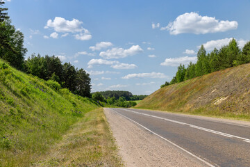 Fototapeta na wymiar small hills through which the highway passes