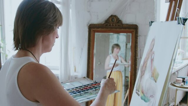 An artist at work in her studio