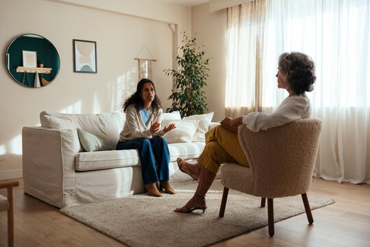 Patient discussing mental health issues with psychologist at home