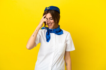 Airplane stewardess woman isolated on yellow background laughing