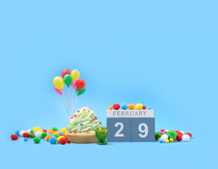 February 29 date calendar, Frog, Birthday cupcakes, festive decor, balloons on blue abstract...