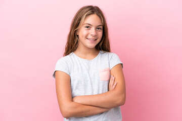 Little caucasian girl isolated on pink background keeping the arms crossed in frontal position