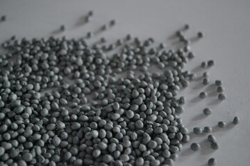 Grey granules with shadows