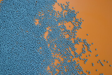 Gray compounds on an orange background