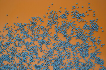 Gray compounds on an orange background