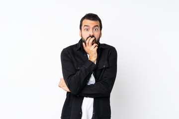 Young man with beard over isolated white background surprised and shocked while looking right