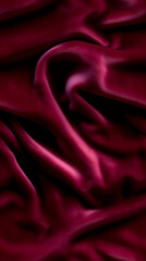 Luxurious red or purple velvet/satin fabric texture with elegant ripples. Seamless texture.
