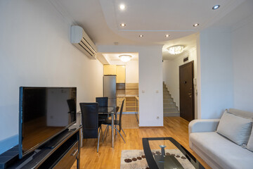 Open plan apartment interior with kitchen and dining space