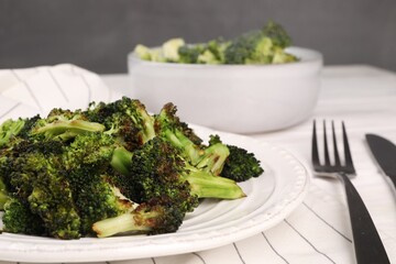 Tasty fried broccoli served on white table, closeup