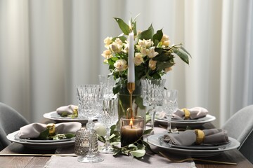 Beautiful table setting with floral decor indoors