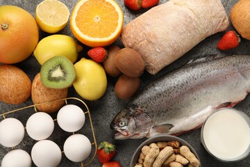 Allergenic food. Different fresh products on grey table, flat lay