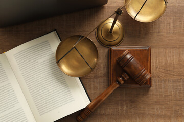 Law concept. Gavel, book and scales of justice on wooden table, flat lay