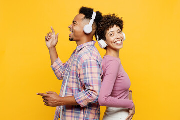 Young couple two friends family man woman of African American ethnicity wear purple casual clothes...