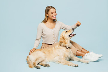 Full body side view young smiling happy owner woman she wear casual clothes sits give her best...