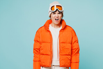 Skier sad strict young woman wear warm padded windbreaker jacket hat ski goggles mask look camera...