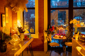 Beautifully decorated table for a New Year's holidays at cozy home during festive evening