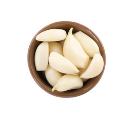 Peeled cloves of fresh garlic in bowl isolated on white, top view