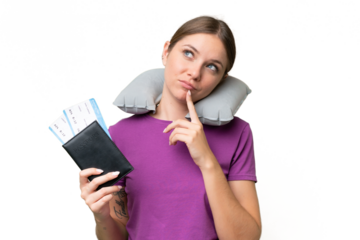 Young beautiful blonde woman with Inflatable travel Pillow over isolated background having doubts