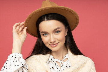 Smiling young woman in a straw hat