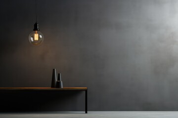 Minimalist interior design with pendant lighting. Textured gray wall and sleek wooden table. A pendant lamp hangs above the table - obrazy, fototapety, plakaty