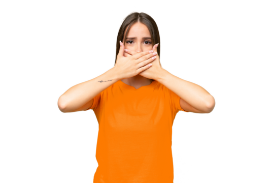 Young pretty caucasian woman over isolated background covering mouth with hands