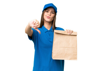 Young beautiful caucasian woman taking a bag of takeaway food over isolated background showing thumb down with negative expression