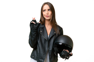 Young pretty caucasian woman with a motorcycle helmet over isolated background with fingers crossing and wishing the best