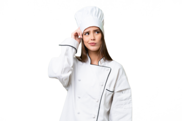 Young chef caucasian woman over isolated background having doubts and with confuse face expression