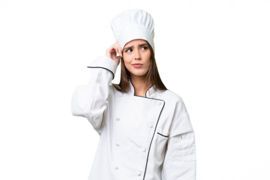 Young chef caucasian woman over isolated background having doubts and with confuse face expression