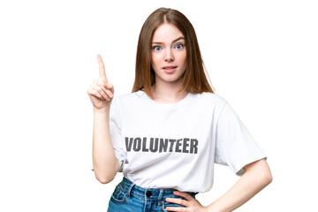 Young volunteer woman over isolated chroma key background thinking an idea pointing the finger up