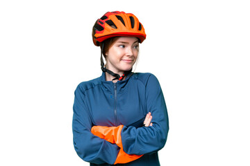 Young cyclist woman over isolated chroma key background making doubts gesture while lifting the shoulders - obrazy, fototapety, plakaty