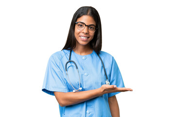 Young African american nurse woman over isolated background presenting an idea while looking smiling towards - obrazy, fototapety, plakaty
