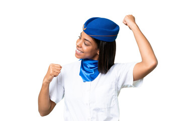 Airplane stewardess African american woman over isolated background celebrating a victory