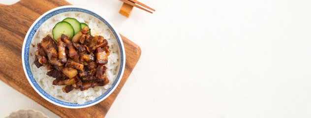 Braised pork belly meat over cooked rice, famous and delicious street food in Taiwanese restaurant.