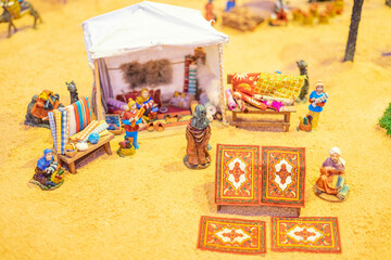 Human representation model on a reduced scale measuring approximately 10cm.