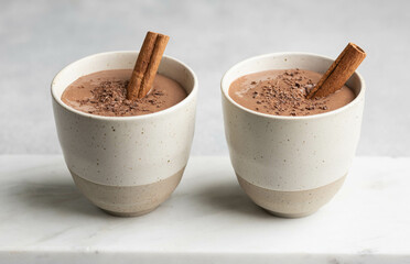 Hot chocolate drink in ceramic cups , selective focus