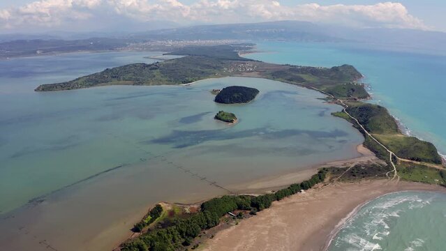 4K aerial - a bird's eye view&nbsp;video (Ultra High Definition) of Zvernec Beach. Attractive seascape of Adriatic sea. Fantastic morning scene of Albania, Europe. Beauty of nature concept background..
