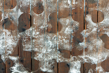Top View of Melting Ice on Pedestrian Wooden Path, Macro Shot