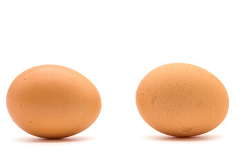 Two Brown chicken eggs isolated on a white background