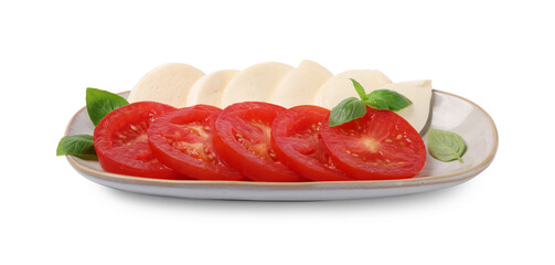 Plate of delicious Caprese salad with tomatoes, mozzarella and basil isolated on white